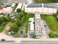 URGENT SALE - L-shaped commercial land behind HomePro, near Central and Lotus Suratthani. Area 1 rai 8.4 sq. wah, frontage 16 m.