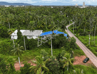Urgent sale! Vacant land 1 rai 1 ngan 57.3 sq. wah (2,229.2 sq. meters) in a prime location near Wat Pradu, behind HomePro, close to Surat Thani Hospital and CentralSurat Thani. 18-meter frontage.