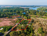 Land for sale in Surat Thani, 2 rai, 100 meters frontage, beautiful plot, easy to plan, suitable for projects or agriculture. Price 3.7 million. Thung Gong, Kanchanadit.