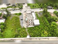 URGENT SALE - L-shaped commercial land behind HomePro, near Central and Lotus Suratthani. Area 1 rai 8.4 sq. wah, frontage 16 m.