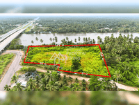 Urgent sale: Vacant land in Surat Thani, next to the Tapi River, near Ford Showroom, Bangkok Hospital, and Central Department Store. Size 6 rai 46 square wah.