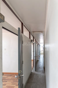 [Reserved] 3-story dormitory, 8 bedrooms, 4 bathrooms, 21.9 sq. wah. Located 200 meters from the back gate of the provincial school. Good location, great value for 3.X million baht. Surat Thani.