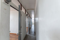 [Reserved] 3-story dormitory, 8 bedrooms, 4 bathrooms, 21.9 sq. wah. Located 200 meters from the back gate of the provincial school. Good location, great value for 3.X million baht. Surat Thani.