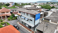 [Reserved] 3-story dormitory, 8 bedrooms, 4 bathrooms, 21.9 sq. wah. Located 200 meters from the back gate of the provincial school. Good location, great value for 3.X million baht. Surat Thani.