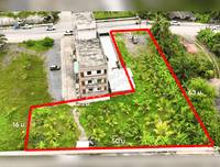 URGENT SALE - L-shaped commercial land behind HomePro, near Central and Lotus Suratthani. Area 1 rai 8.4 sq. wah, frontage 16 m.
