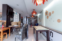 Urgent sale: Corner commercial building, 2 units, 5 bedrooms, 4 bathrooms, 3 kitchens, built-in + fully furnished. Prime location in Sri Kasem, heart of Surat Thani.