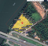 Urgent sale: Vacant land in Surat Thani, next to the Tapi River, near Ford Showroom, Bangkok Hospital, and Central Department Store. Size 6 rai 46 square wah.