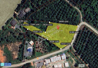 Urgent sale, vacant land in Surat Thani, 800 m from Bangkok Hospital. Bang Chum Tho area, 3 rai 3 ngan 50.8 sq. wah. A natural stream flows through the middle of the plot, connecting to the Tapi River.